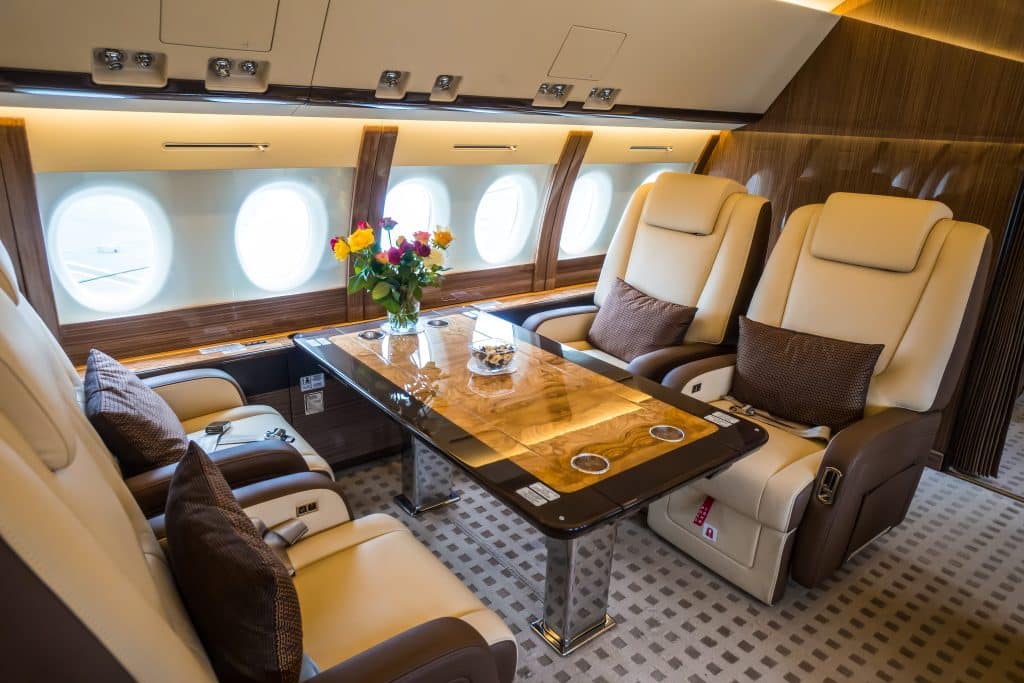 flying on a private jet beige interior