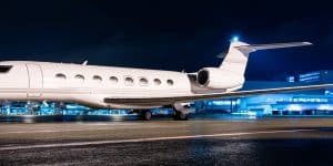 empty leg charter flights jet parked at night